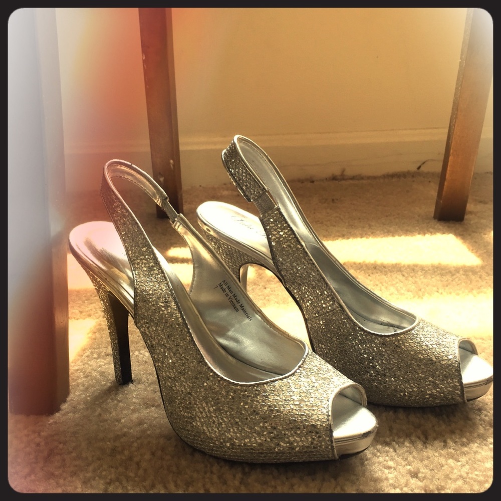 Size 7 open toe, heel strap, sparkly sliver heels!